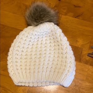 White beanie with natural color poof